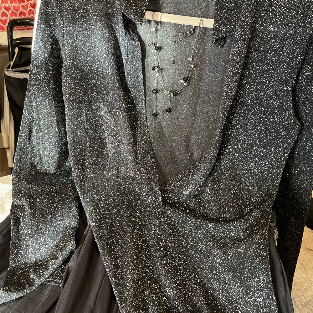 The limited, black top size medium